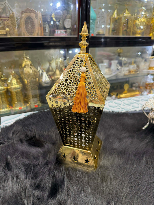 Gold Ramadan lantern with stars and moons